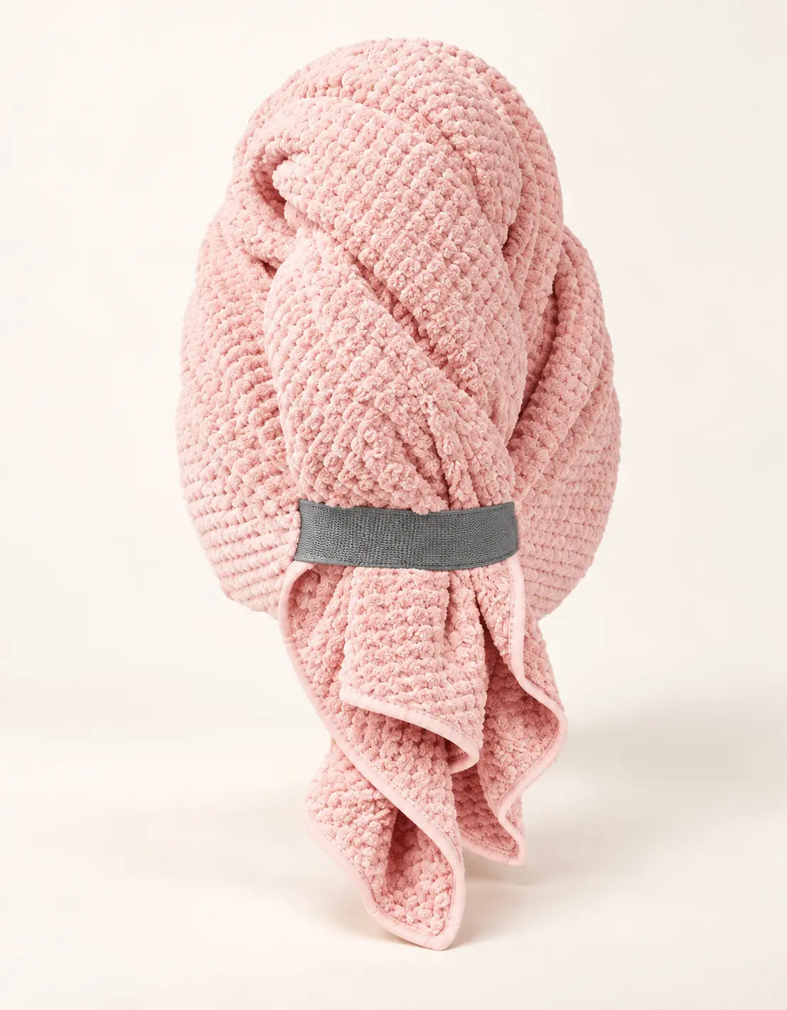Pink BELARO quick-dry hair towel wrap with elastic strap on a cream background