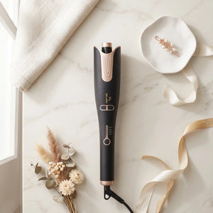 BELARO Intelligent Curl hair styling tool arranged on a marble surface with soft beauty accessories