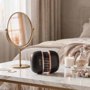 BELARO compact cordless hairbrush displayed on a marble vanity with beauty accessories